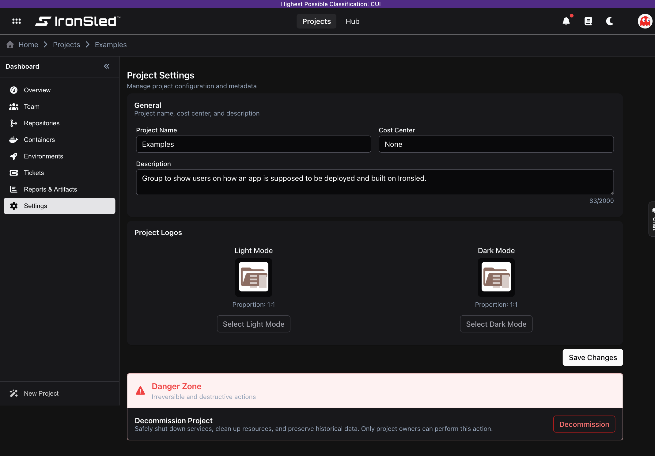 The Settings section for the Examples project — the General panel (Project Name, Cost Center, and Description fields), the Project Logos uploaders for light and dark mode, a Save Changes button, and the Danger Zone for decommissioning and deletion